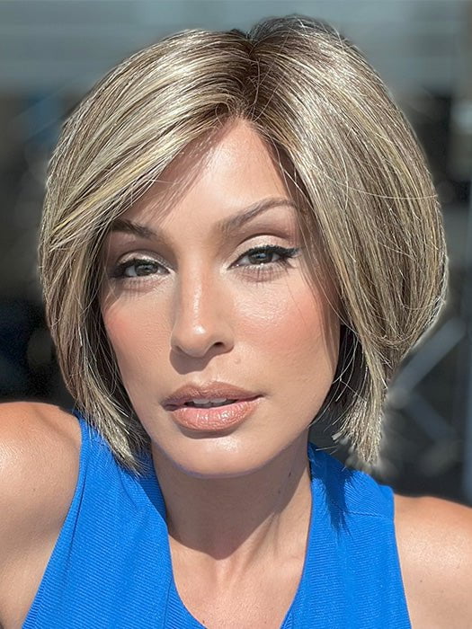 Model is wearing RAINBOW by ELLEN WILLE in color SAND MULTI ROOTED 14.24.12 | Medium Ash Blonde, Lightest Ash Blonde, and Lightest Brown Blend with Dark Shaded Roots