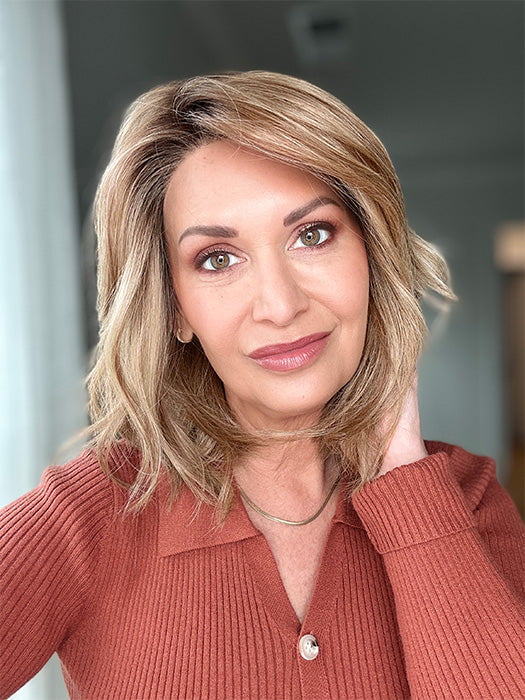 Emily H. @she_sheds_more wearing TERESA by BELLE TRESS in color CARAMEL TOFFEE BLONDE-R | Toffee is a warm, dimensional shade blending medium brown with golden blonde and caramel highlights. Softly rooted for a natural, sun-kissed finish.