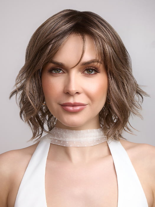 Terra by Amore in color BRONDE-R | Dark brown and natural medium blond tones are mixed together and shaded with medium dark brown roots for a realistic appearance.