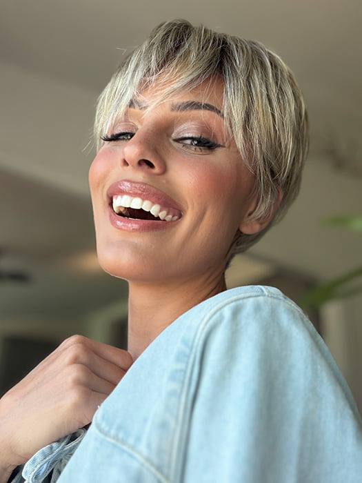 Roxie is wearing TESS by JON RENAU in color FS17/101S18 PALM SPRINGS BLONDE | Light Ash Blonde w/ Pure White Natural Violet, Shaded w/ Dark Natural Ash Blonde
