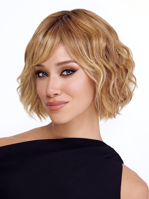 Model is wearing TREND by TRESSALLURE in color 14/26/R10 | Red Blonde with Gold Blonde Highlights and Light Brown Roots
