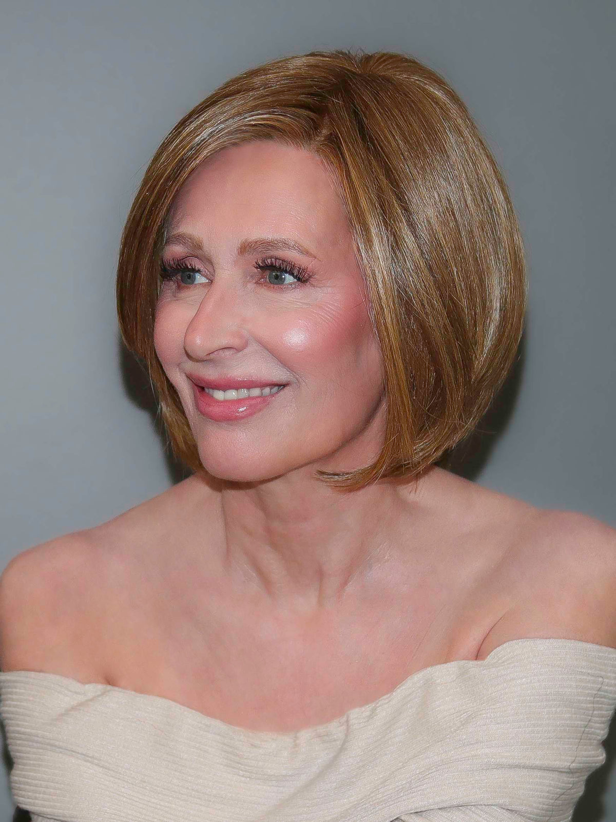 STRAIGHT UP WITH A TWIST by Raquel Welch in RL12/16 HONEY TOAST | Light Brown Evenly Blended with Dark Natural Blonde