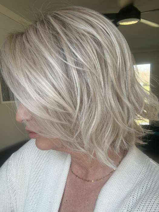 Emily H. @she_sheds_more wearing Alicante by BelleTress in shade CRUSHED ALMOND BLONDE R | A soft Neutral Light Blonde with a Light and Medium Blended Root Color.