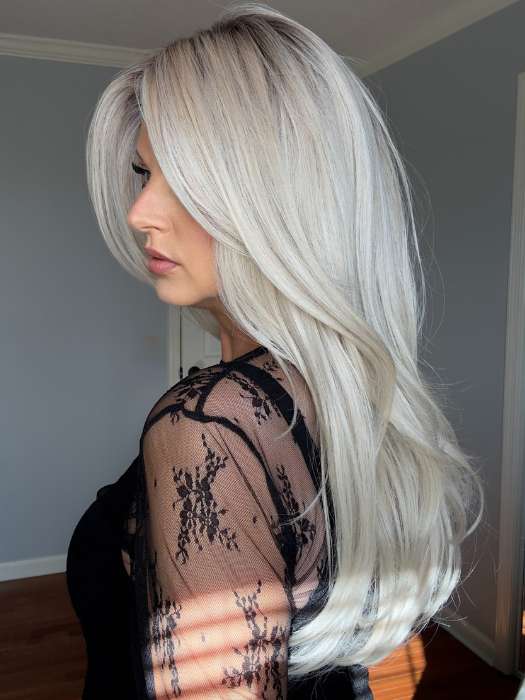 Sandy @i_be_wiggin wearing FEATURE LENGTH by Raquel Welch in color RL16/22SS SHADED ICED SWEET CREAM | Pale Blonde with Slight Platinum Highlighting with Dark Roots
