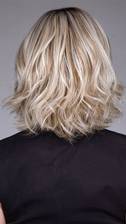 Model is wearing VICTORIA by BELLETRESS in color BUTTERBEER R | Dark Brown Base and Root that transitions smoothly into a buttery blonde, infused with creamy honey and toffee tones