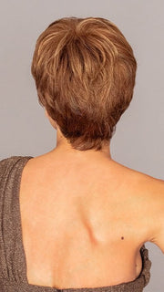 Roxie wigs.com model is wearing the WINNER by RAQUEL WELCH in color R3025S+ GLAZED CINNAMON | Medium Auburn with Ginger Blonde Highlights on Top