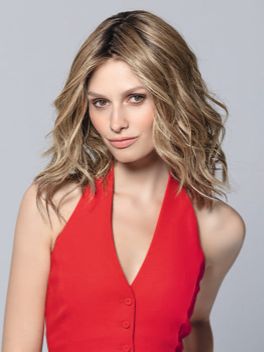 Model is wearing DEMI MONO by ELLEN WILLE in color BERNSTEIN ROOTED | Light Brown base with subtle Light Honey Blonde and Light Butterscotch Blonde highlights and Dark 