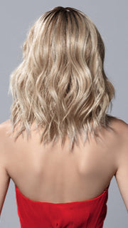 Model is wearing DEMI MONO by ELLEN WILLE in color PEARL BLONDE ROOTED | Pearl Platinum and Lightest Ash Blonde with Medium Ash Blonde Blend and Shaded Roots