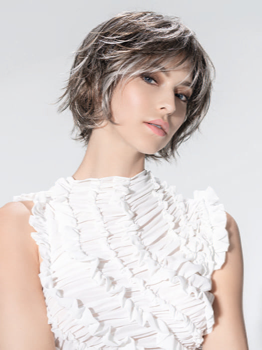 Model is wearing ESCAPE SOFT by ELLEN WILLE in color SMOKE FROSTED 38.36.60 | Light Brown and Medium Brown with Pearl White and Grey Blend with a Soft Matte Finish