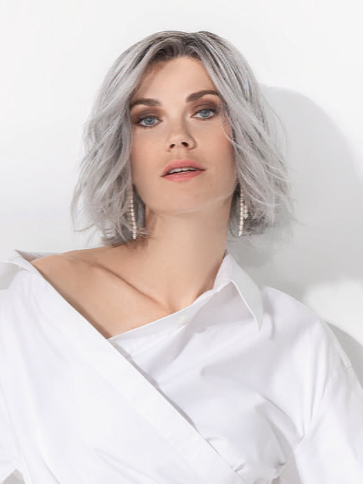 Model is wearing ESPRIT SOFT SMALL by ELLEN WILLE in color METALLIC GREY ROOTED 60.51 |  Pearl White, Darkest/Lightest Brown with Grey Blend with Shaded Roots