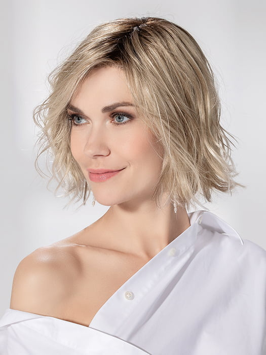 Model is wearing ESPRIT SOFT SMALL by ELLEN WILLE in color PEARL BLONDE ROOTED | Pearl Platinum and Lightest Ash Blonde with Medium Ash Blonde Blend and Shaded Roots