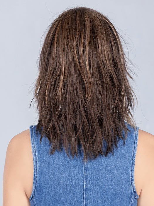Model is wearing COFFEE BROWN LIGHTED | Dark Brown and Medium Warm Brown with Medium Blonde Blends with Highlights Throughout and Concentrated in the Front