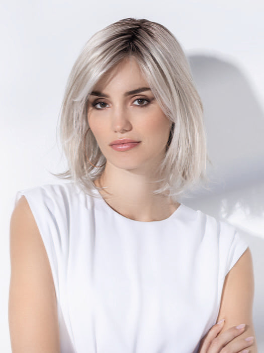 Model is wearing ICONE SMALL DELUXE by ELLEN WILLE in  SILVER BLONDE ROOTED | Pearl White and Lightest Pale Blonde Blend with Shaded Roots