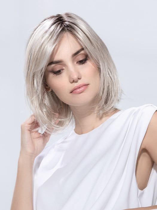 Model is wearing ICONE SMALL DELUXE by ELLEN WILLE in  SILVER BLONDE ROOTED | Pearl White and Lightest Pale Blonde Blend with Shaded Roots
