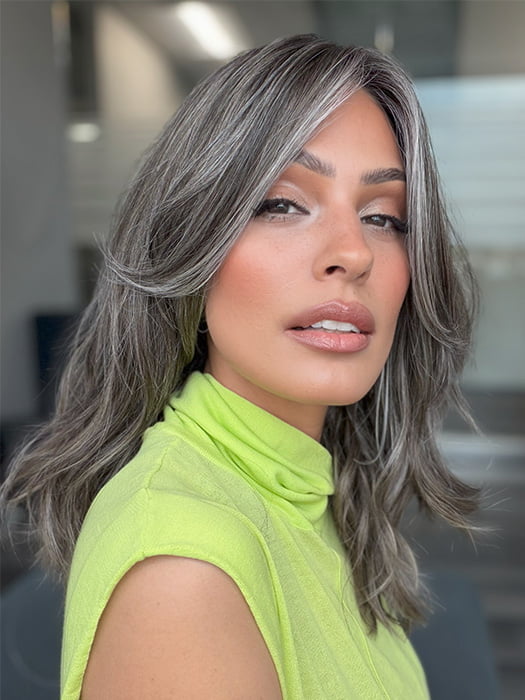 Model is wearing MAUDE by AMORE in color MUSHROOM-GREY-R |  Dark brown incorporates light brown and silvery grey tones with shadow roots for a stylish finish.