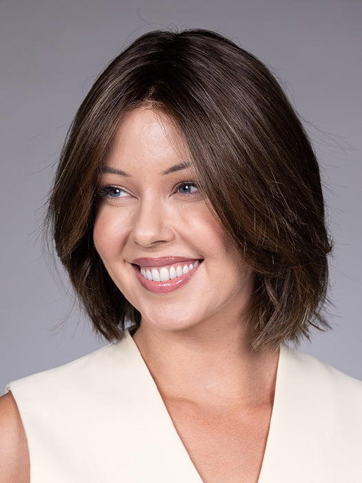 Model is wearing DUBLIN by BELLETRESS in color COOLEST ASH BROWN R | A combination of Light Ash Brown, Cool Medium Brown and a hint of Dark Blonde and Dark Roots