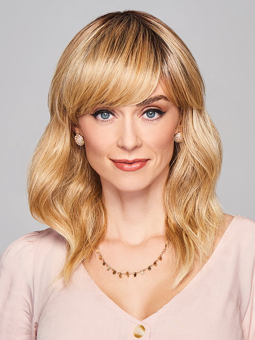 Model is wearing ASPIRATION by GABOR in color SS-LIGHT-BLONDE | Light Blonde with Golden Highlights & Dark Brown Roots