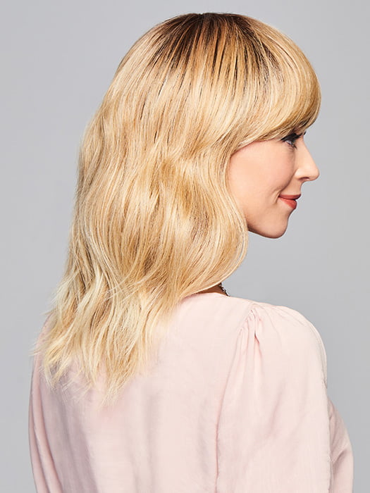 Model is wearing ASPIRATION by GABOR in color SS-LIGHT-BLONDE | Light Blonde with Golden Highlights & Dark Brown Roots