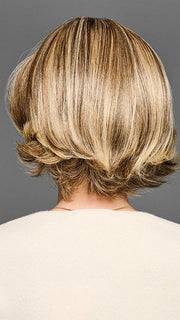 Model is wearing STAND OUT STYLE by GABOR in color GF12-22SS SHADED CAPPUCCINO | Light Golden Brown Evenly Blended with Cool Platinum Blonde Highlights with Dark Roots