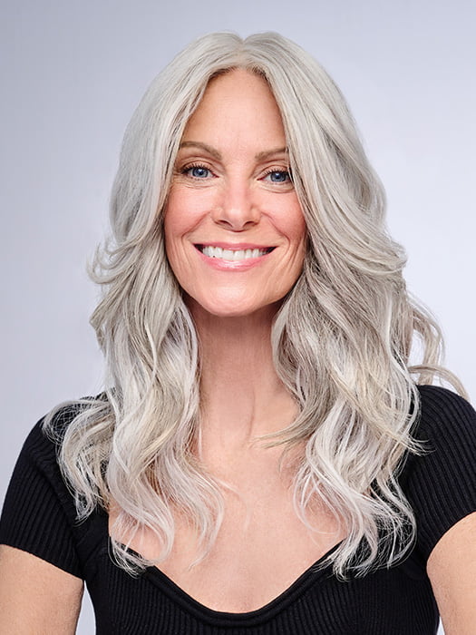 Model is wearing 16" AU NATUREL WAVES TOPPER by HAIRDO in color R56/60 SILVER MIST | Lightest Gray with 20% Medium Brown Evenly Blended with Pure White