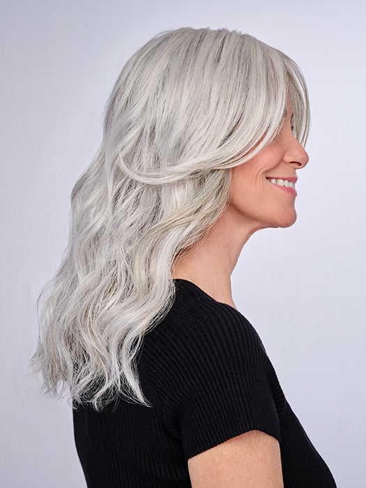Model is wearing 16" AU NATUREL WAVES TOPPER by HAIRDO in color R56/60 SILVER MIST | Lightest Gray with 20% Medium Brown Evenly Blended with Pure White