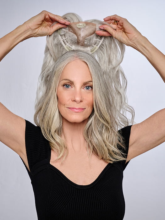 Model is wearing 16" AU NATUREL WAVES TOPPER by HAIRDO in color R56/60 SILVER MIST | Lightest Gray with 20% Medium Brown Evenly Blended with Pure White