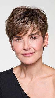 Model is wearing CROP CUT TOPPER by HAIRDO in color SS9/24 ICED CAFÉ LATTE | Dark Brown shaded with Golden Brown