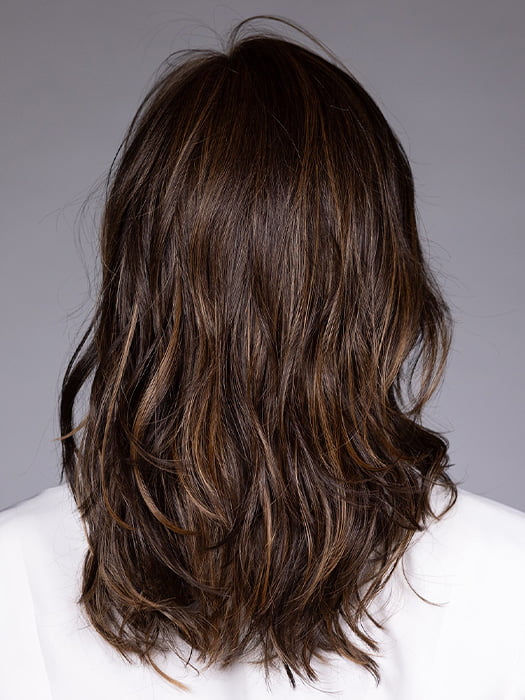 Model is wearing MUNICH by BELLETRESS in color MOCHA MAPLE BROWN | A mix of Dark Brown, Medium Brown, Light Auburn, Medium Strawberry