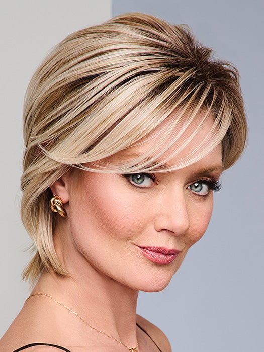 Model is wearing BOUTIQUE CHIC by RAQUEL WELCH in RL19/23SS SHADED BISCUIT | Light Ash Blonde Evenly Blended with Cool Platinum Blonde with Dark Roots