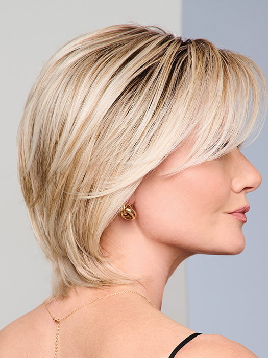 Model is wearing BOUTIQUE CHIC by RAQUEL WELCH in RL19/23SS SHADED BISCUIT | Light Ash Blonde Evenly Blended with Cool Platinum Blonde with Dark Roots