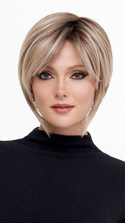 Model is wearing THE ROUGE by TRESSALLURE in color 36/25/23/R6 MOON DUST | Dark salt and pepper base with blended golden blonde and cool platinum tones, shaded with Dark Roots