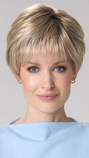 Model is wearing TIFFANY HAND TIED by ENVY in color SILKY BEIGE | Light Platinum Blonde with Dark Brown Roots