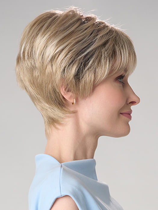 Model is wearing TIFFANY HAND TIED by ENVY in color SILKY BEIGE | Light Platinum Blonde with Dark Brown Roots
