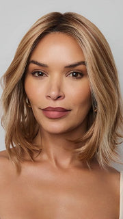 Model is wearing YUI by NORIKO in color GLAZED CARAMEL R | Warm Brown and Dark Blonde Tones with Ashy Highlights and a Dark Root