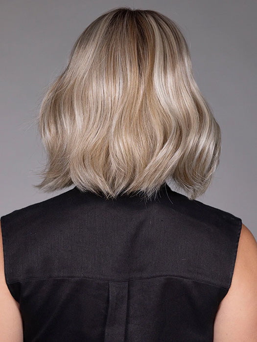 Model is wearing AMI in color BUTTER BEER R | A rich blend of warm brunette and golden honey highlights finished with a soft, natural root.