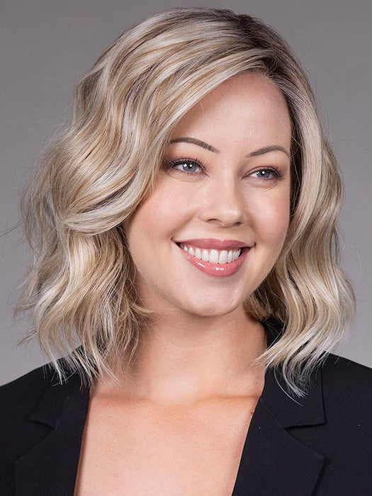 Model is wearing VERONICA in Butter Beer R | Dark Brown Base and Root that transitions smoothly into a buttery blonde, infused with creamy honey and toffee tones