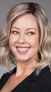 Model is wearing VERONICA in Butter Beer R | Dark Brown Base and Root that transitions smoothly into a buttery blonde, infused with creamy honey and toffee tones