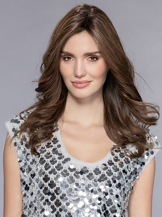 Model is wearing ANISE by ELLEN WILLE in CHOCOLATE ROOTED 830.27.6 | Medium to Dark Brown base with Light Reddish Brown highlights and Dark Roots