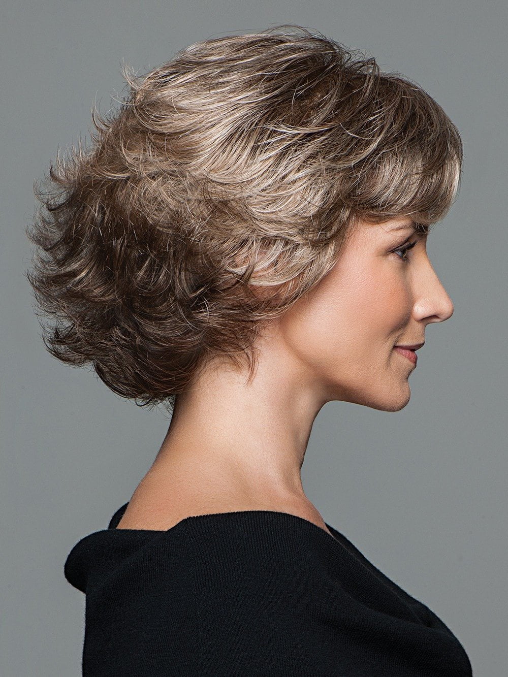 A a fresh silhouette of all-over curled layers are just right with a light and luxurious hand-knotted top