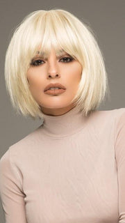  A super chic bob with full bangs and a center skin part