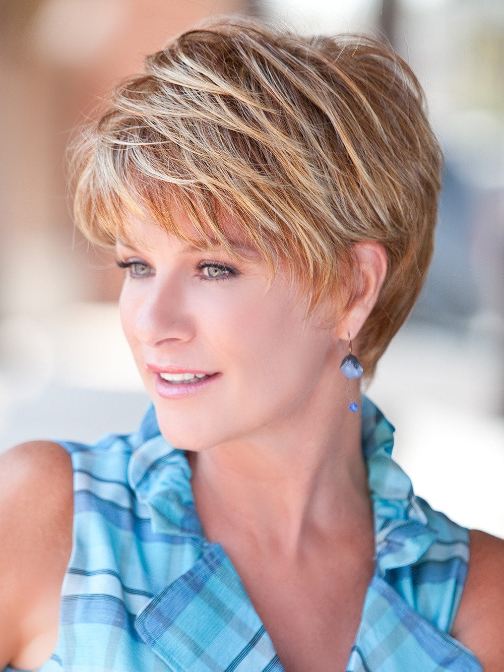 Short and natural classic hair style with subtle layering and tapered edges