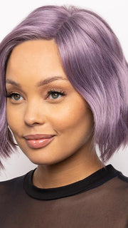 This heat-friendly synthetic style has a lace front and left lace part for styling versatility