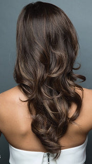 Transform yourself with this long style and short wispy cut on the left side. | Color: Marble Brown LR Warm Rich Brown with a soft Golden-Brown Ombre.